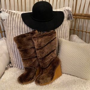 Only tried on. Never worn. Tory Burch womens fur boots